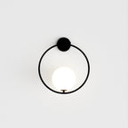 Modern Globe Wall Sconce with Slim Stem and Round Backplate
