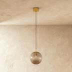 Glass Globe Pendant Light with Brass Ceiling Canopy