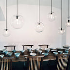 Clear Glass Globe Pendant Light with Metal Disc Canopy and Adjustable Cord