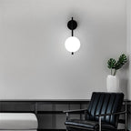 Modern Globe Wall Sconce with Slim Stem and Round Backplate