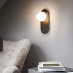 Modern Globe Wall Sconce with Slim Stem and Round Backplate