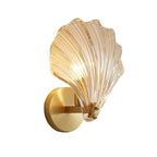Seashell Wall Sconce with Clear Ribbed Shell Shade and Brass Finish Arm