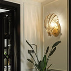 Seashell Wall Sconce with Clear Ribbed Shell Shade and Brass Finish Arm
